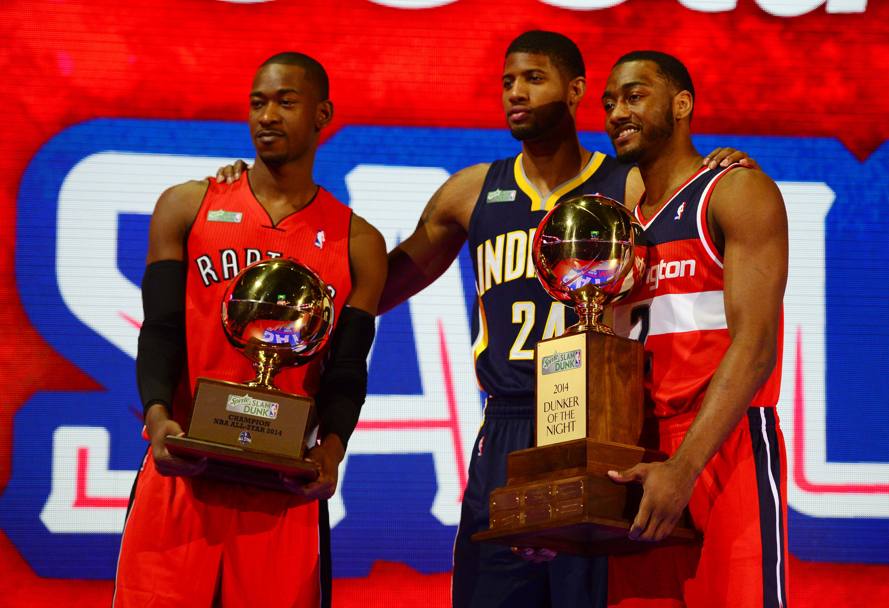 John Wall, a destra, con Terrence Ross (Toronto Raptors) e Paul George (Indiana Pacers). Reuters